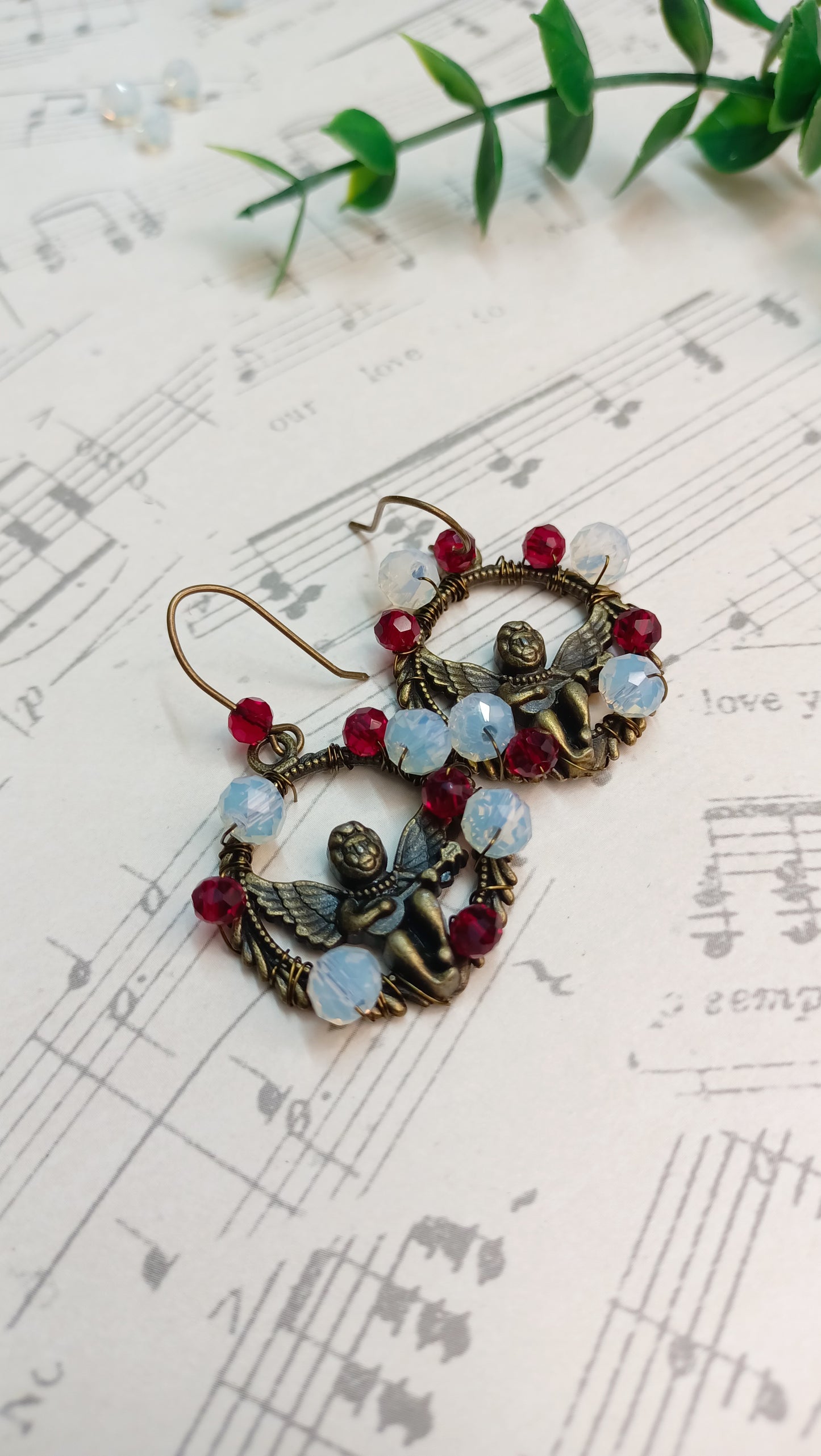 Elegant angel earrings with festive bead accents