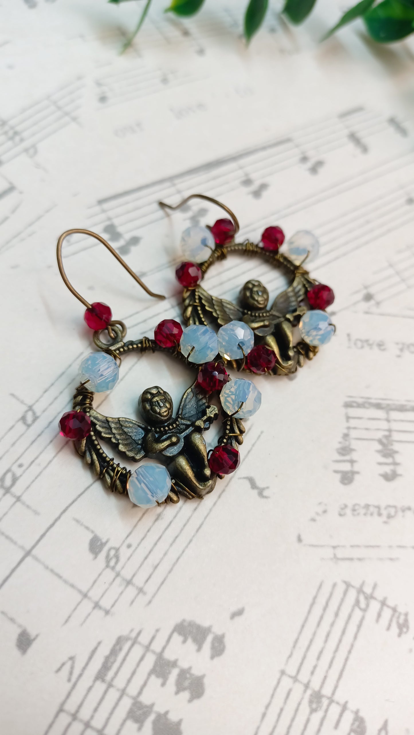 Decorative angel earrings featuring colorful beads