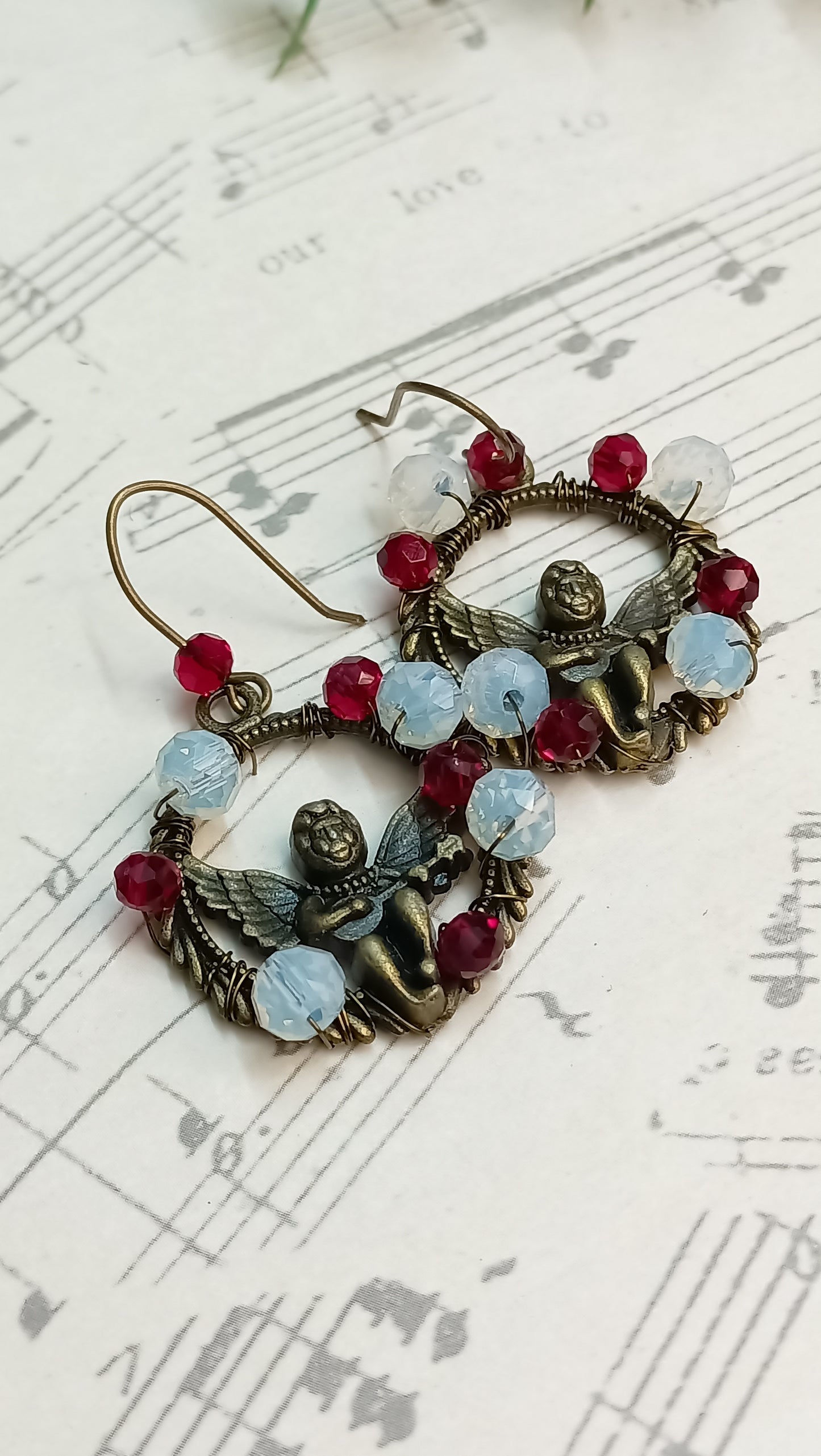Vintage-style angel earrings adorned with beads