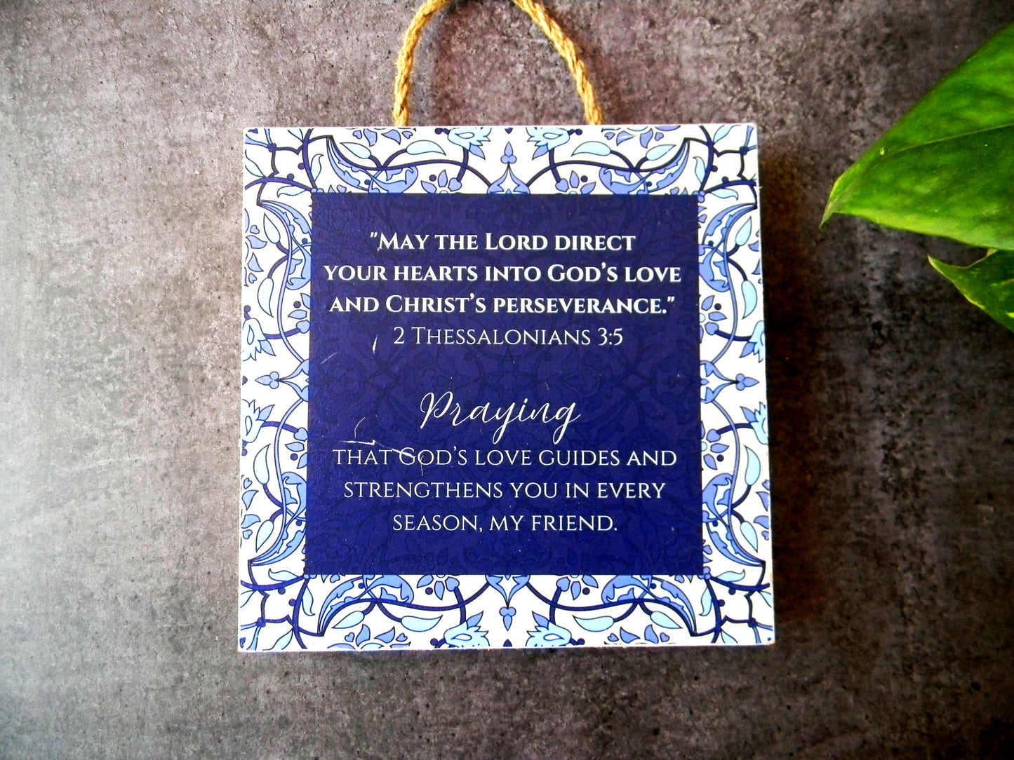 Handmade 6x6 inch decorative wall hanger with 'May the Lord direct your hearts' scripture in blue floral design. Perfect Christian gift for home or office decor.