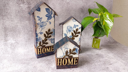 Floral table decor houses with 'Home' text