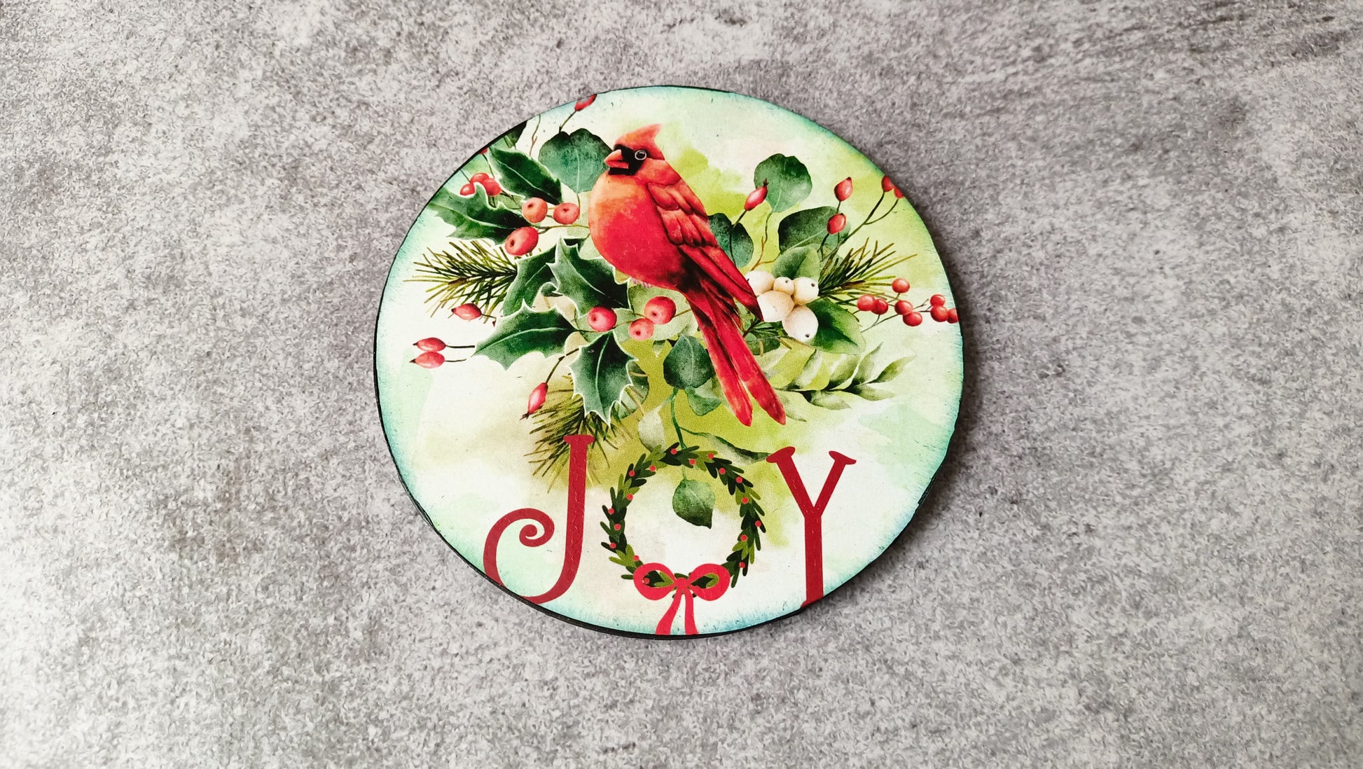 Joy coaster with cardinal and wreath design