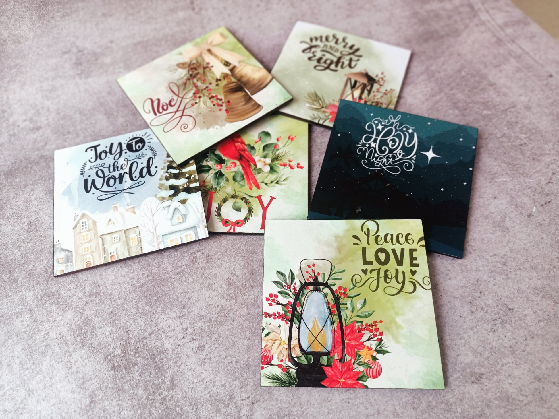 Christmas-themed square coasters with festive designs