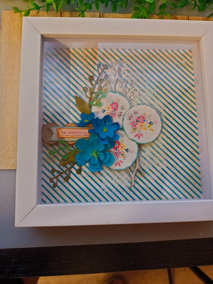 Inspirational frame with floral design and 'be amazing' message