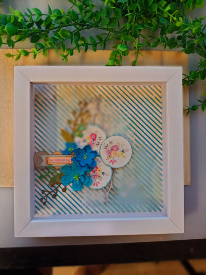 Inspirational frame with floral design and 'be amazing' message