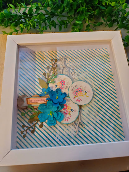 Inspirational frame with floral design and 'be amazing' message