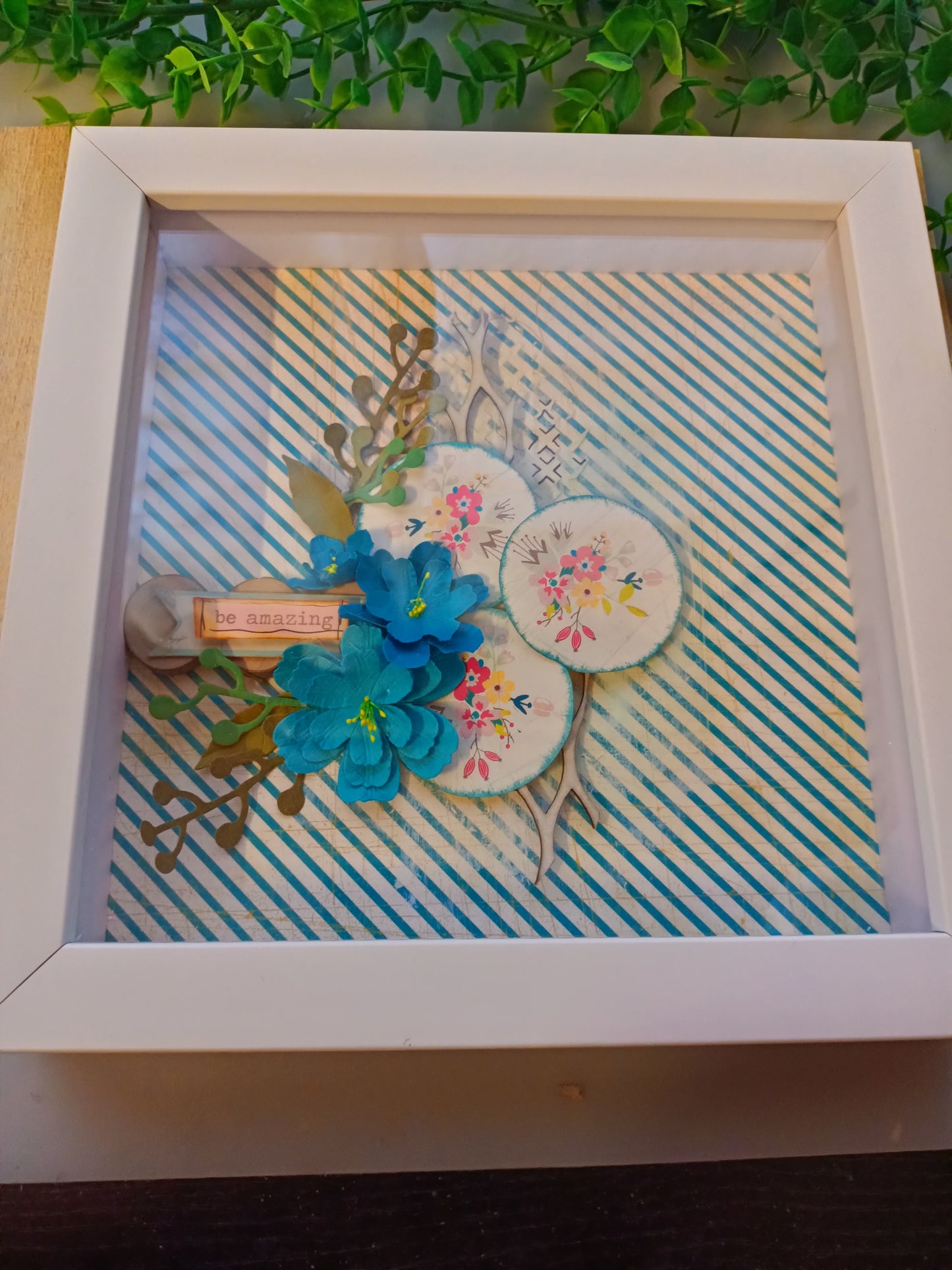 Inspirational frame with floral design and 'be amazing' message