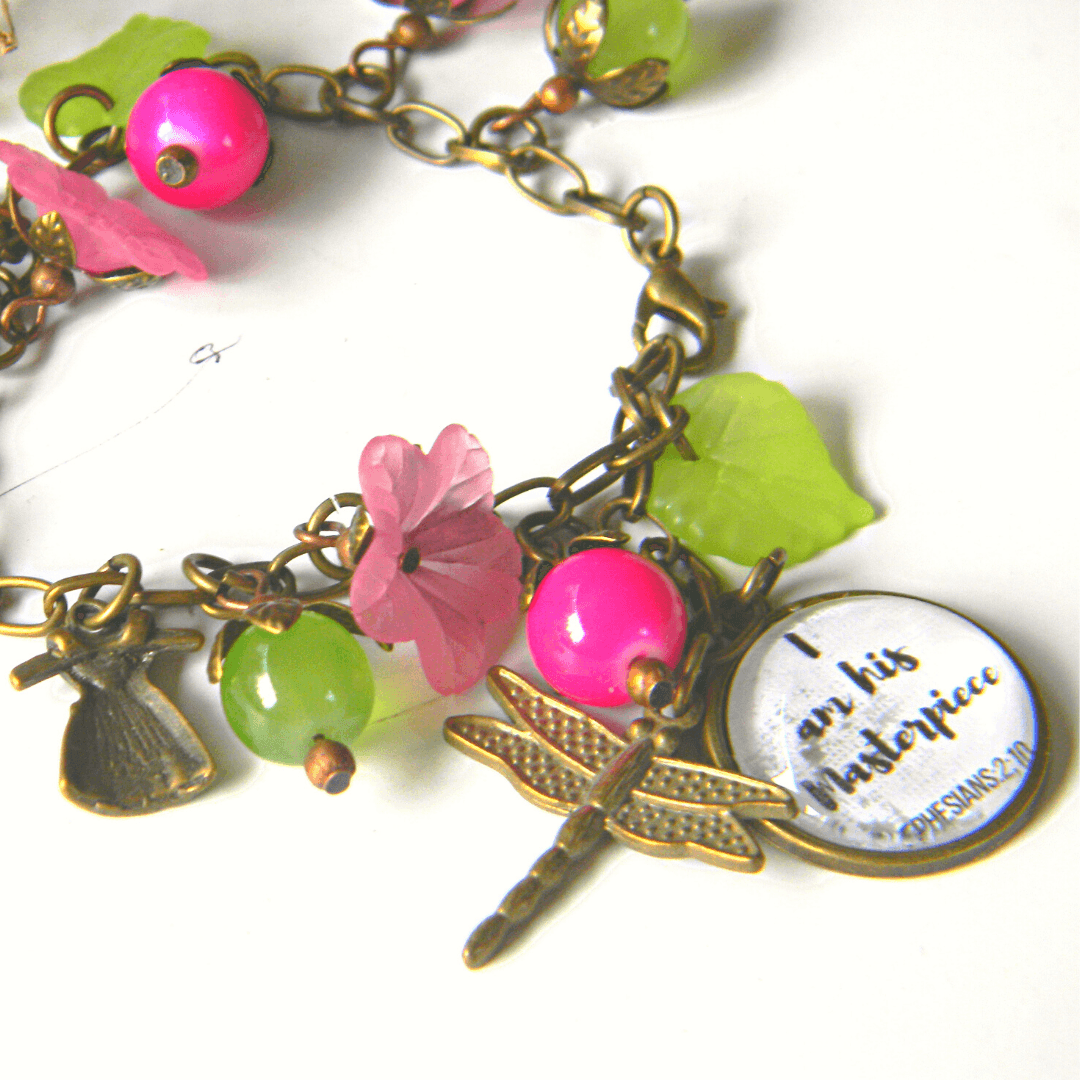 Handmade scripture bracelet with colorful beads and charms.