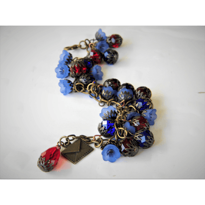 Efflorescence bracelet with intricate blue and red floral design