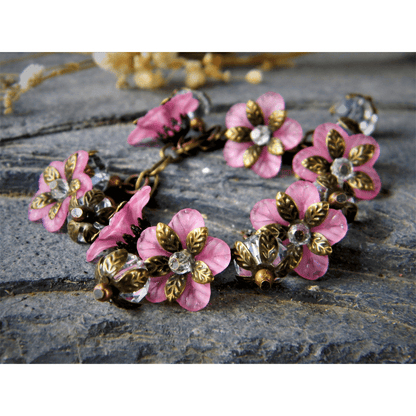 Vintage-inspired pink bracelet with floral glass bead design.