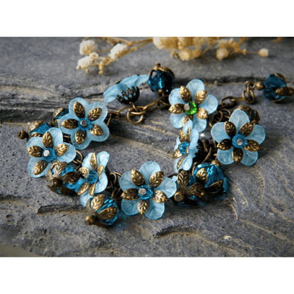 Blue floral bracelet with vintage-inspired glass beads.