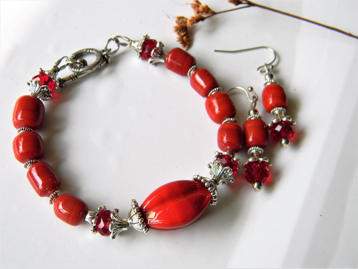 Red glass bead bracelet and earrings set with silver accents